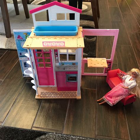 barbie fold up doll house.